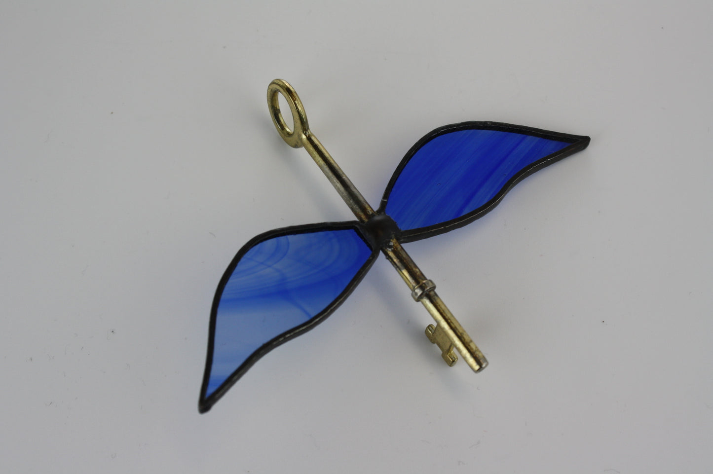 Flying key with four wings Stained Glass