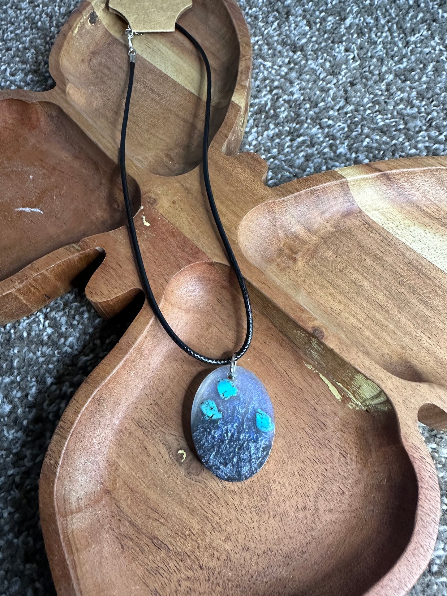 Medium oval resin pendant silver and blue clear pigment