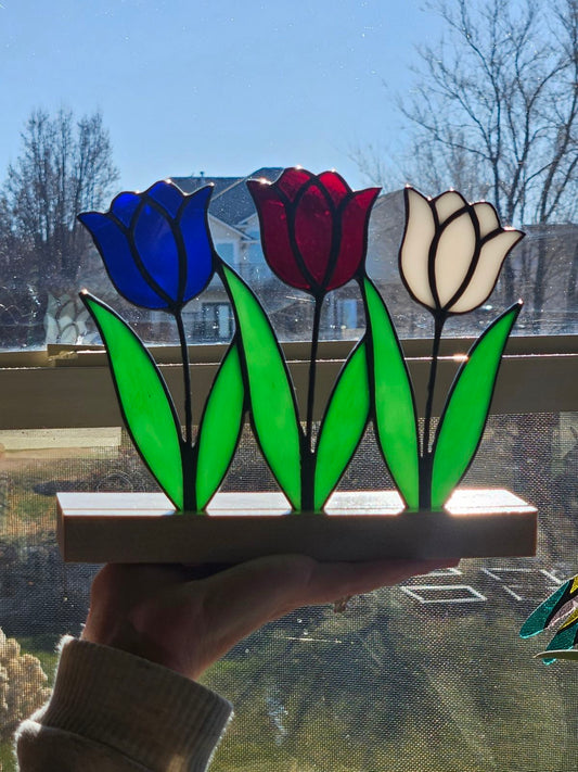3 tulips with wood base