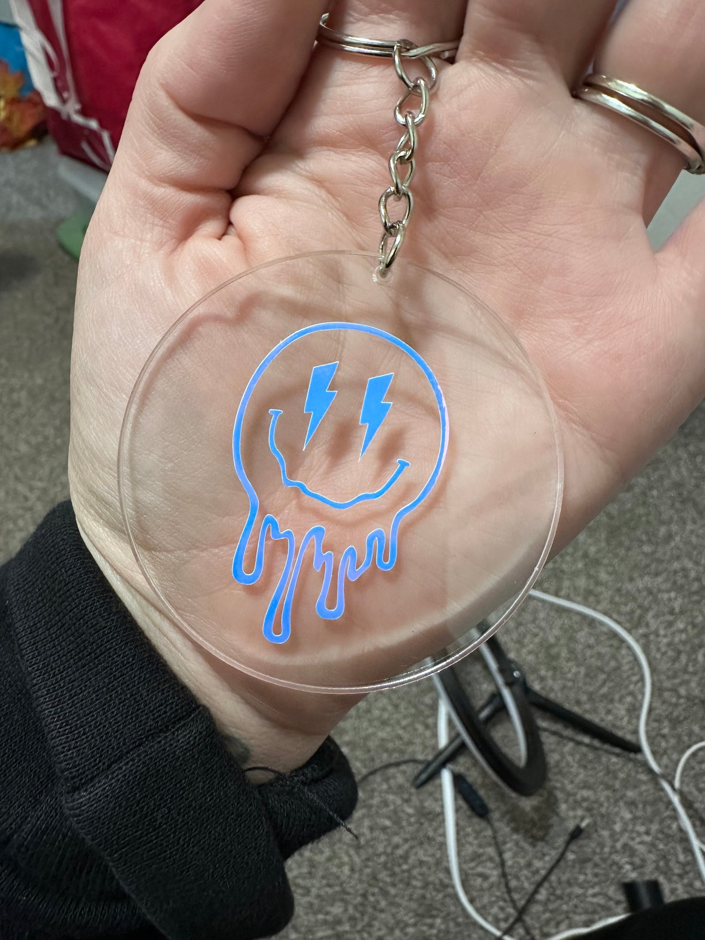 Acrylic keychain with vinyl drippy smiley face