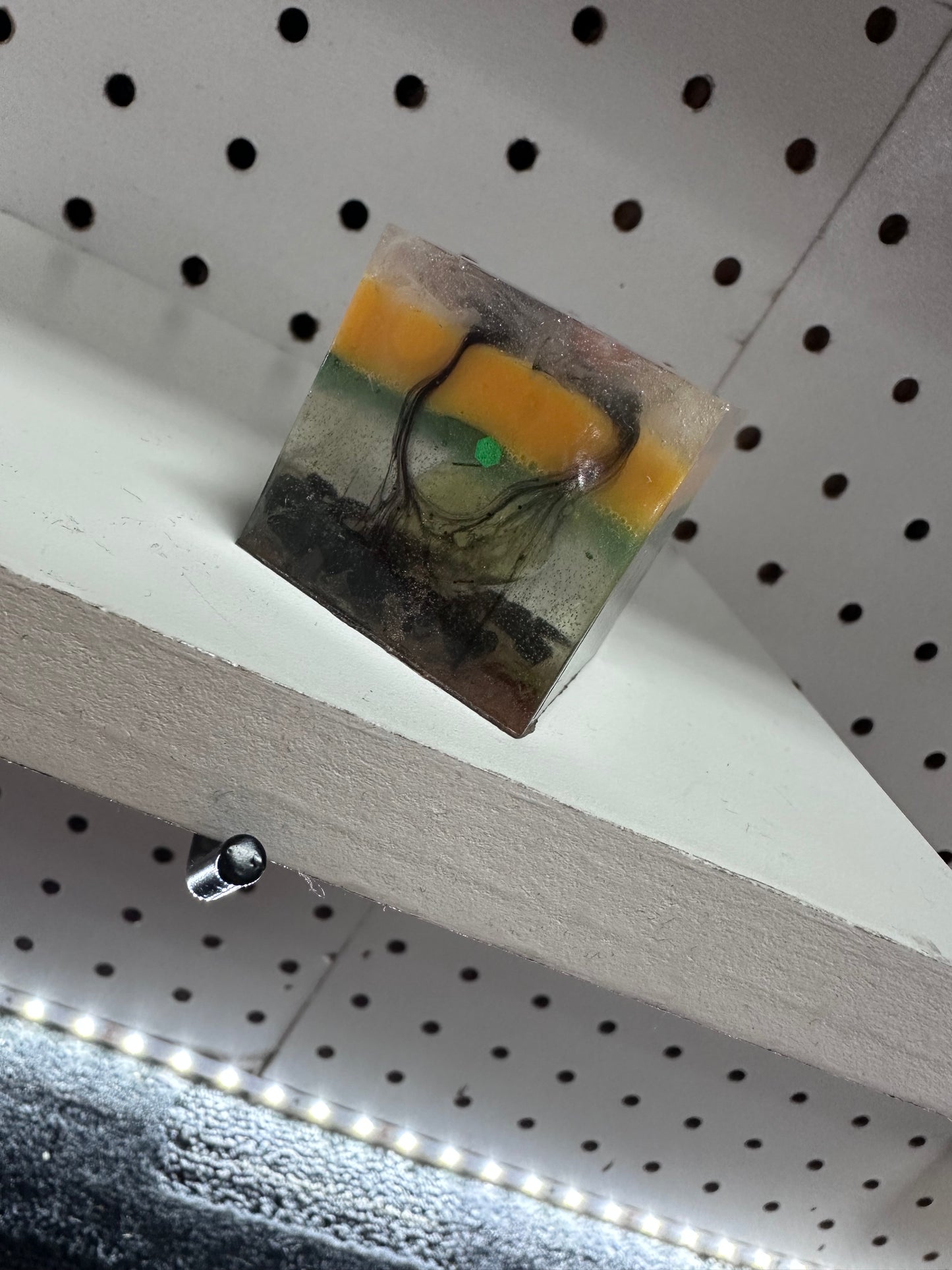 Multi colored resin cube with stones