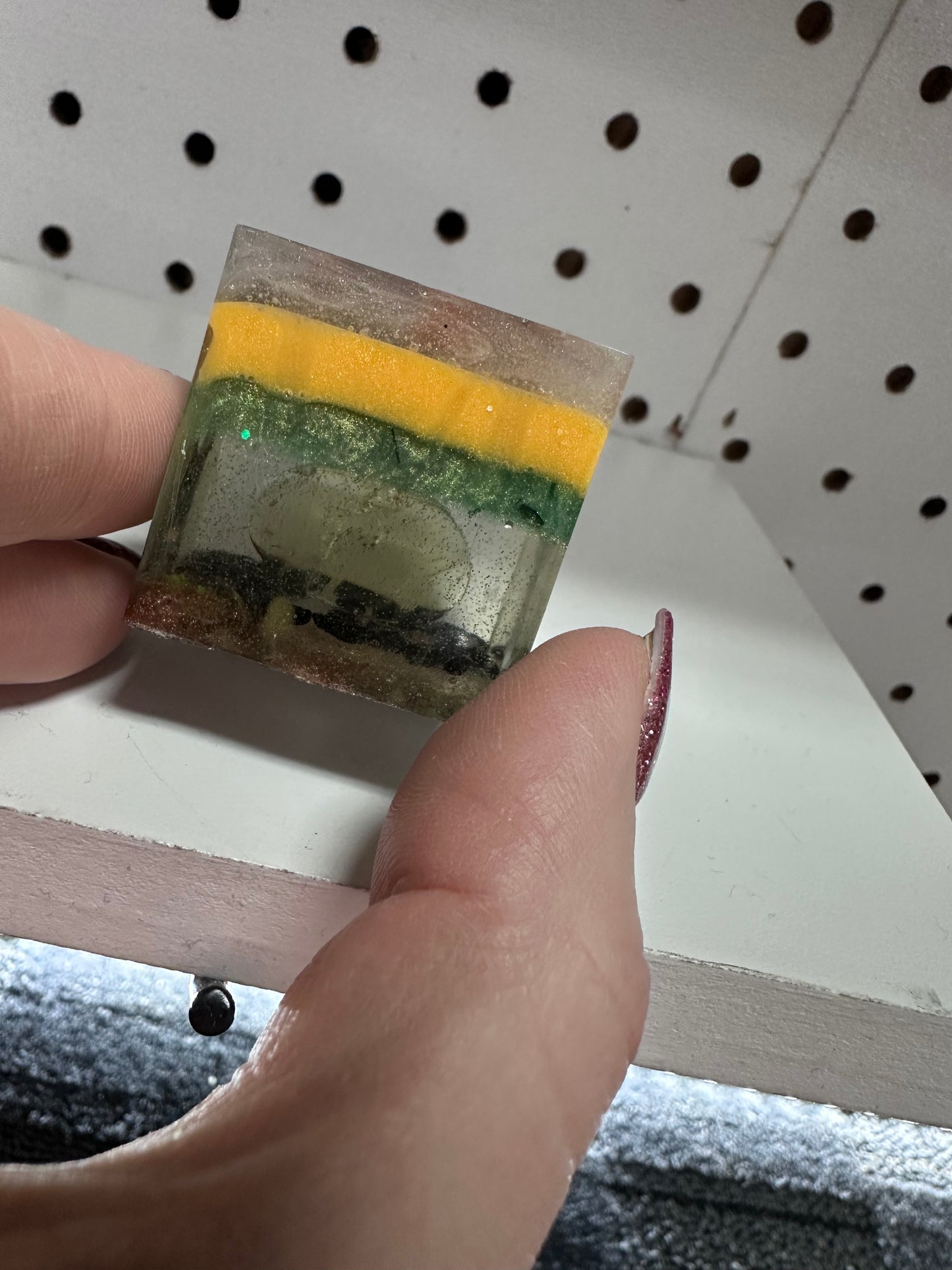 Multi colored resin cube with stones